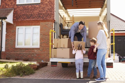 Workers planning hazards and safe moving methods before a removal job