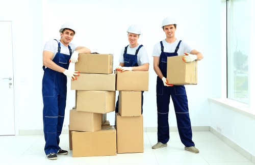 Workers and compliance paperwork symbolizing anti-slavery oversight in Uxbridge removals