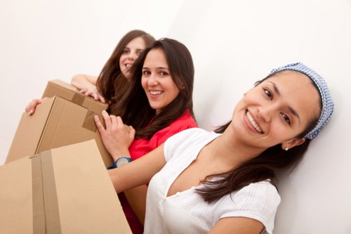 Professional movers handling furniture in a flat move in Uxbridge