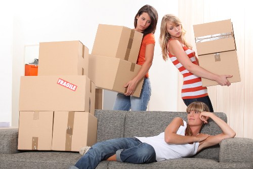 Removals van loading household items near Uxbridge residential property