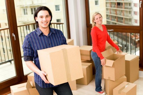 Boxes and furniture being loaded into a removal truck